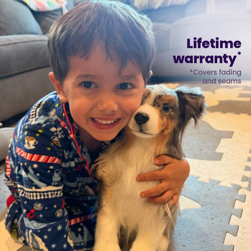 Lifetime warranty: a boy hugging the custom stuffed animal of his tan and white dog