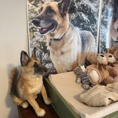 Two custom stuffed animal replicas, a large and a small dog, side by side